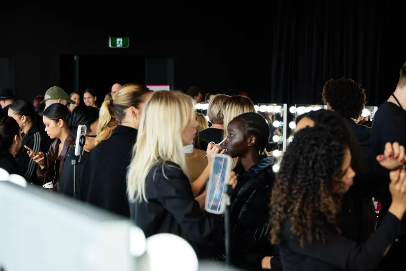 Yulia Kuzmina working behind the scenes on hair and makeup